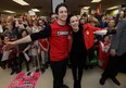 Scott Moir and Tessa Virtue are welcomed by their excited fans after arriving at London International Airport Monday from the Winter Olympics where they won gold in the ice dance competition. Hundred greeted Moir, of Ilderton, and Virture, of London, who took the time to pose for photos and sign autographs for the crowd. (MORRIS LAMONT/THE LONDON FREE PRESS)