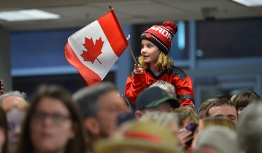 A fan on dad's shoulders waiting with a large crowd to see Scott Moir and Tessa Virtue arriving at London International Airport on Monday February 26, 2018 back from the Olympic games where they won gold in the ice dance MORRIS LAMONT/THE LONDON FREE PRESS /POSTMEDIA NETWORK