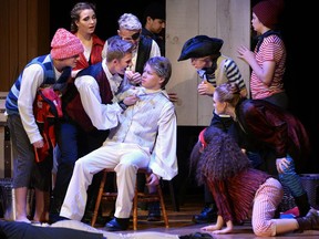 Black Stache, played by Michael Jenkinson, puts a knife to the throat of Lord Astor (Brandon Jackson) in the Lucas secondary school production of Peter and the Starcatcher. (MORRIS LAMONT/THE LONDON FREE PRESS)