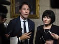 Minister of Health Ginette Petitpas Taylor stands with Eric Hoskins, former Ontario Minister of Health, after the tabling of the budget in the House of Commons on Parliament Hill in Ottawa on Tuesday, Feb. 27, 2018. Hoskins will chair a federal government advisory council to implement a national pharmacare plan. THE CANADIAN PRESS