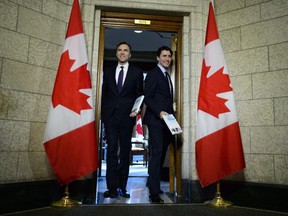 Minister of Finance Bill Morneau walks with Prime Minister Justin Trudeau as they leave his office on route to deliver the federal budget in the House of Commons on Parliament Hill in Ottawa on Tuesday, Feb. 27, 2018. (THE CANADIAN PRESS/Sean Kilpatrick)