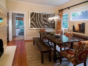 Colour and texture complement a photograph of a zebra to establish a sense of exoticism in this dining room. (STEPHEN YOUNG, Laura Casey Interiors)