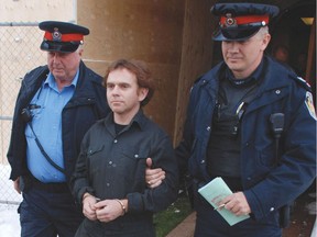 The family of Clifford Fair feel  John Douglas Robinson, 42, being led away by police from the Woodstock courthouse in 2012, is "getting away with murder" after he was sentenced Tuesday March 20 to only two more years in prison for killing Fair.  (File photo)