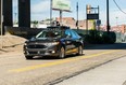 A 2016 pilot model of an Uber self-driving car travels in Pittsburgh, Pa. An Uber vehicle was in autonomous mode, with an operator behind the wheel, when it hit a woman walking in the street in Tempe, Ariz. 
AFP FILE PHOTO