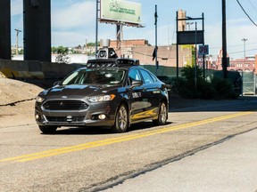 A 2016 pilot model of an Uber self-driving car travels in Pittsburgh, Pa. An Uber vehicle was in autonomous mode, with an operator behind the wheel, when it hit a woman walking in the street in Tempe, Ariz. 
AFP FILE PHOTO