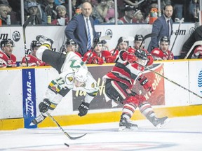 London Knights forward Nathan Dunkley collides with Ottawa 67’s defenceman Merrick Rippon in Ontario Hockey League action Sunday in Ottawa. (Special to Postmedia News)