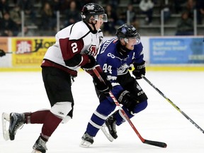 London Nationals' Brenden Trottier (44) and Chatham Maroons' Dakota Bohn (2) chase the puck in the first period at Chatham Memorial Arena in Chatham, Ont., on Thursday, March 23, 2017. (Postmedia Network file photo)