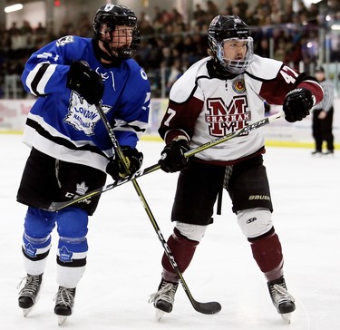 London Nationals' Colin Wilson, left, and Chatham Maroons' Dawson Garcia battle in the first period of Game 3 in their GOJHL Western Conference semifinal at Chatham Memorial Arena in Chatham, Ont., on Sunday, March 18, 2018. Mark Malone/Chatham Daily News/Postmedia Network