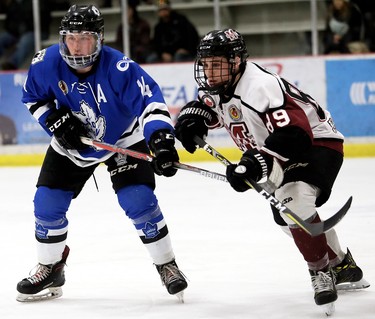 London Nationals' Brandon Glover, left, and Chatham Maroons' Steven Fowler battle in the first period of Game 3 in their GOJHL Western Conference semifinal at Chatham Memorial Arena in Chatham, Ont., on Sunday, March 18, 2018. Mark Malone/Chatham Daily News/Postmedia Network