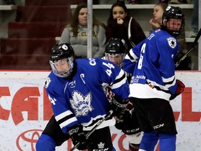 London Nationals' Brenden Trottier (44) wins a battle for the puck along the boards against the Chatham Maroons in the first period of Game 3 in their GOJHL Western Conference semifinal at Chatham Memorial Arena in Chatham, Ont., on Sunday, March 18, 2018. Mark Malone/Postmedia Network