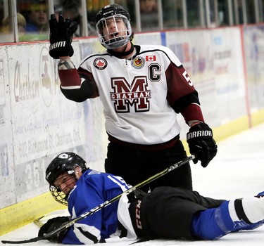 Chatham Maroons captain Noah Bushnell complains after being whistled for a boarding penalty on London Nationals' Kyle Dawson during the first period of Game 6 in their  Western Conference semifinal in the Greater Ontario Junior Hockey League at Chatham Memorial Arena in Chatham, Ont., on Thursday, March 22. Mark Malone/Postmedia Network