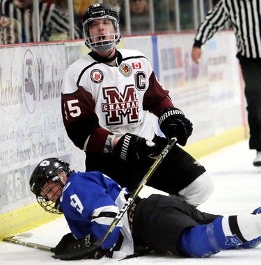Chatham Maroons captain Noah Bushnell complains after being whistled for a boarding penalty on London Nationals' Kyle Dawson during the first period of Game 6 in their  Western Conference semifinal in the Greater Ontario Junior Hockey League at Chatham Memorial Arena in Chatham, Ont., on Thursday, March 22. Mark Malone/Postmedia Network