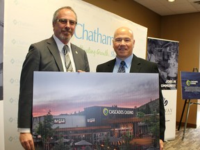 Chatham-Kent Mayor Randy Hope, left, and Gateway Casinos & Entertainment Ltd. chief executive Tony Santo show off what the new Cascades Casino Chatham facility will look like after plans for the project were unveiled in Chatham  Wednesday, March 28.
Ellwood Shreve/Chatham Daily News/Postmedia News