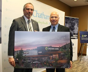 Chatham-Kent Mayor Randy Hope, left, and Gateway Casinos & Entertainment Ltd. chief executive Tony Santo show off what the new Cascades Casino Chatham facility will look like after plans for the project were unveiled in Chatham  Wednesday, March 28.
Ellwood Shreve/Chatham Daily News/Postmedia News