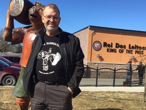 Dave Broostad, who owns Full Circle, a group benefits business for for small business, and is a board member of the Hamilton Road business association, stands outside Hamilton Road iconic business, King of Pigs. The business association would like to see more funding from the city for Hamilton Road improvements. (NORMAN DE BONO, The London Free Press)