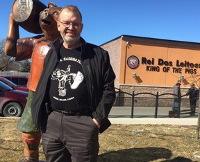 Dave Broostad, who owns Full Circle, a group benefits business for for small business, and is a board member of the Hamilton Road business association, stands outside Hamilton Road iconic business, King of Pigs. The business association would like to see more funding from the city for Hamilton Road improvements. (NORMAN DE BONO, The London Free Press)