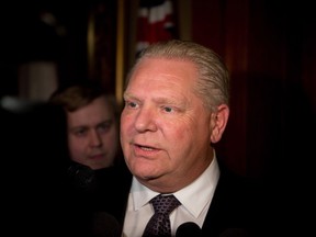 Ontario PC leader Doug Ford talks to media after a caucus meeting at Queen's Park in Toronto on Tuesday, March 20, 2018.