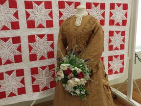 This wedding dress is brown; the tradition of white dresses didn't come into full force until after Queen Victoria wore white for her own nuptials, sparking a tradition that continues to this day. (DAN BROWN, The London Free Press)