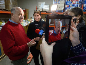 Glen Pearson and Jane Roy at Friday's launch of the London Food Bank's spring collection drive. (Morris Lamont/The London Free Press)