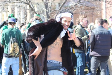 Jamal Kett strikes a pose outside a house party in downtown London. Police were busy clearing out St. Patrick's Day parties around Western University and down Saturday afternoon. DALE CARRUTHERS / THE LONDON FREE PRESS