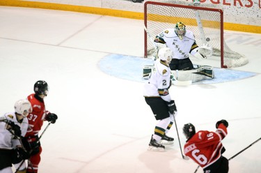 Kevin Hancock of the Owen Sound Attack scores a power-play goal on London Knights goaltender Joseph Raaymakers in the first period of Game 1 of an Ontario Hockey League best-of-seven Western Conference quarterfinal Thursday in Owen Sound. The Attack won 5-4. Greg Cowan/The Sun Times.