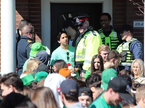 London police were busy clearing out house parties, including this one on Central Avenue, for St. Patrick's Day on Saturday. DALE CARRUTHERS / THE LONDON FREE PRESS
