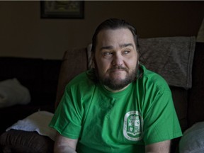 Stephen Charlton, shown at his home in London, says he suffers such extreme pain from the complications of diabetes that he sometimes can’t walk from his bed to his bathroom. And he says his blackouts are so frequent that he’s been rushed to emergency rooms 34 times during the past few years. (Derek Ruttan/The London Free Press)