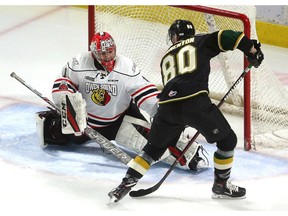 Alex Formenton of the Knights picked a perfect end boards bank shot by Evan Bouchard and flipped the rolling puck over the glove hand of Owen Sound's Mack Guzda opening the scoring early in their Friday night game in Budweiser Gardens on Friday January 26, 2018.  (Mike Hensen/The London Free Press)