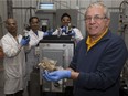 Franco Berruti and his team — Mohammad Hossain, left, Sonil Nanda and Frabricio Guayaquil — use pyrolysis machines to break down waste into oils, gases and char at Western University’s Institute for Chemicals and Fuels from Alternative Resources. (Derek Ruttan/The London Free Press)