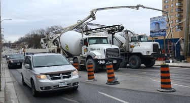 Traffic on York Street was reduced to one lane as workers pour over 1300 cubic meters of concrete forming a raft slab foundation for a new 24-floor residential tower on York Street at Thames street in London, Ontario on Tuesday March 6, 2018. The foundation will need 165 truck-loads of concrete some from as far away as Kitchener. The towers are hoped to be completed in early 2020. MORRIS LAMONT/THE LONDON FREE PRESS /POSTMEDIA NETWORK