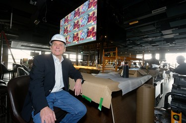 David Terry, vice-president and general manager of The Rec Room, sits at the island bar featuring a flat screen that can show 12 television images at once at The Rec Room under construction at Masonville Mall on Wednesday March 7, 2018. MORRIS LAMONT/THE LONDON FREE PRESS /POSTMEDIA NETWORK