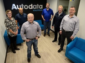 The executive team at Autodata Solutions — Mary Holbrook, left, director of human resources, Keith Murray, chief operator, Chris Wedermann, chief information officer, Hans Otten, vice-president of architecture, Greg Perrier, chief executive, and Neal James,chief financial officer — show off the firm’s new digs in the Bell building downtown. (MORRIS LAMONT/THE LONDON FREE PRESS)