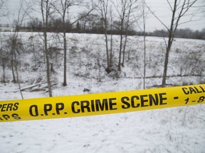 The Ontario Provincial Police continued their investigation on Thursday after the discovery of human remains in a gully behind 10194 Turner Rd. near St. Thomas on Monday.  (Derek Ruttan/The London Free Press)