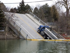 The bridge spanning Catfish Creek in Port Bruce, Ont. collapsed on February 23, 2018. A dump truck has been stranded on the northern piece of the bridge ever since. Photo shot on Tuesday March 13, 2018. (Derek Ruttan/The London Free Press)