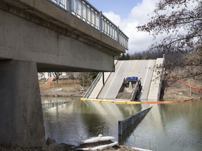 A dump truck sits Tuesday where it landed when the bridge spanning Catfish Creek in Port Bruce collapsed Feb. 23. (DEREK RUTTAN, The London Free Press)