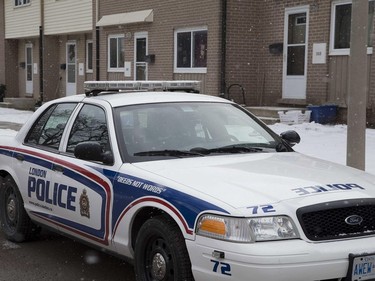 A police car is parked outside the townhouse at 309 Marconi Blvd., second door from the left, which was hit with a shotgun blast early Tuesday morning.
Derek Ruttan/The London Free Press