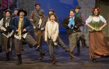 Connor Englert as the Artful Dodger, left, and Hope Wilson as Oliver, centre, sing and dance to Consider Yourself in Oliver! at the Palace Theatre in London Tuesday. Mike Hensen/The London Free Press