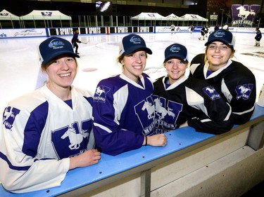 Members of the Western Mustangs Women's Hockey team who also played on the 2015 national championship team, from left, Ali Beres, Megan Taylor, Emma Pearson, and Anthea Lasis pictured before practice at Thompson Arena on Tuesday. MORRIS LAMONT/THE LONDON FREE PRESS