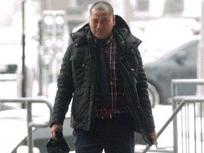 Reuben Garcia enters the courthouse in London, Ont. on Wednesday March 14, 2018. (DEREK RUTTAN, The London Free Press)