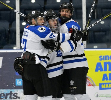 London Nationals Jordan DiCicco, Carson Brookshaw, and Mitchell Webb celebrate London's first goal during game one of their GOJHL semi-final series at the Western Fair Sports Centre on Wednesday March 14, 2018. MORRIS LAMONT/THE LONDON FREE PRESS /POSTMEDIA NETWORK