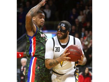 Royce White of the London Lightning works baseline on Chris Braswell of Cape Breton during their Thursday night game at Budweiser Gardens.  
Mike Hensen/The London Free Press