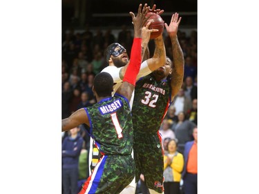 Royce White of the London Lightning goes up for two and a foul against Bruce Massey and  Chris Braswell of Cape Breton during their Thursday night game at Budweiser Gardens.
Mike Hensen/The London Free Press