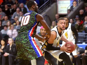 Garrett Williamson fakes a drive baseline on Malik Story of Cape Breton before putting up a fade away during their Thursday night game at Budweiser Gardens London, Ont. on Thursday March 15, 2018.  Mike Hensen/The London Free Press/Postmedia Network