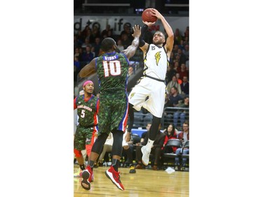 Garrett Williamson of the London Lightning fakes a drive baseline on Malik Story of Cape Breton before putting up a fade away during their Thursday night game at Budweiser Gardens.
Mike Hensen/The London Free Press