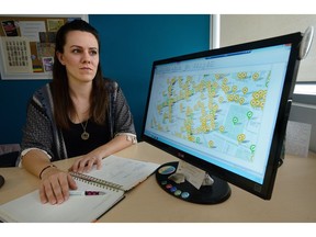 AnnaLise Trudell looks over a "CrowdSpot" map from Melbourne, Australia that shows where citizens feel unsafe on Thursday March 15, 2018. Anova is asking the City of London for $15,000 to help get the ball rolling on the UN Women's Safe Cities initiative. Part of that money will go to setting up a map, similar to the Melbourne one, where Londoners can show where in the city they feel unsafe. (MORRIS LAMONT/THE LONDON FREE PRESS)