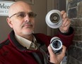 Bob Hoevenaars, president of Alarmtech Security System in London, shows off two megapixel security cameras, a turret camera on top and a bullet camera on the bottom. Both can record in infrared in total darkness, and are hooked up to a PVR system that records video only when there is motion detected. These are the kinds of systems that are prompting a growth in home and business use and drawing police attention for their help during investigations. Mike Hensen/The London Free Press