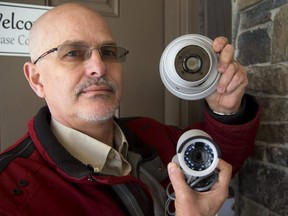 Bob Hoevenaars, president of Alarmtech Security System in London, shows off two megapixel security cameras, a turret camera on top and a bullet camera on the bottom. Both can record in infrared in total darkness, and are hooked up to a PVR system that records video only when there is motion detected. These are the kinds of systems that are prompting a growth in home and business use and drawing police attention for their help during investigations. Mike Hensen/The London Free Press