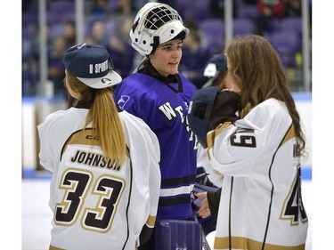 Western Mustangs goaltender Carmen Lasis shakes hands with Manitoba Bisons Devan Johnson, and Taryn Kokesch after losing the Women's Hockey National Championship 2-0 to the Manitoba Bisons at Western University's Thompson Arena on Sunday. Lasis was selected the tournament all-star team goaltender MORRIS LAMONT/THE LONDON FREE PRESS /POSTMEDIA NETWORK