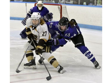 Western Mustangs defenceman Beatrice Dufour keeps Manitoba forward Jordyn Zacharia in check in front of goaltender Carmen Lasis iduring Women's Hockey National Championship gold medal game. Western lost 2-0 to the Manitoba Bisons at Western University's Thompson Arena on Sunday. MORRIS LAMONT/THE LONDON FREE PRESS /POSTMEDIA NETWORK