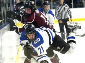 Nationals’ James Turner dodges a check from Chatham Maroons’ Josh King during the first period of Game 5 of the GOJHL Western Conference semifinal at Western Fair in London on Wednesday night. (DEREK RUTTAN, The London Free Press)